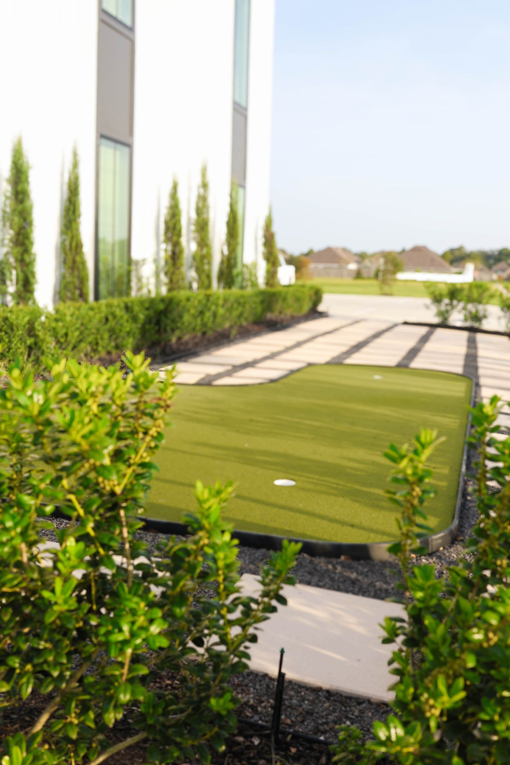 Putting green courtyard at The W Office Suites Putting green and paver walkway in the landscaped courtyard at The W Office Suites in Prairieville, LA