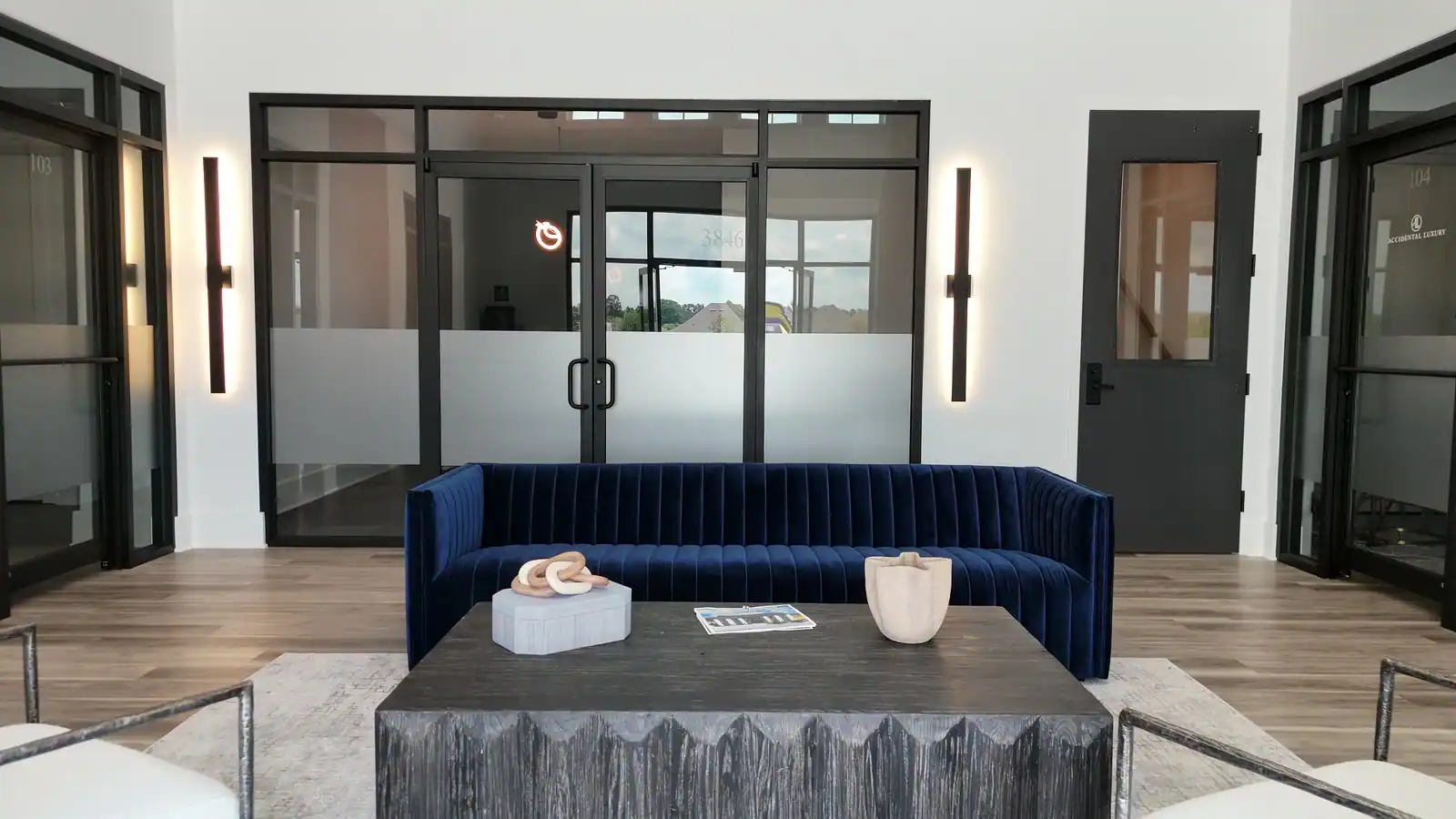 Lobby at The W Office Suites The double-height lobby inside The W Office Suites in Prairieville, LA, seen through the open front doors